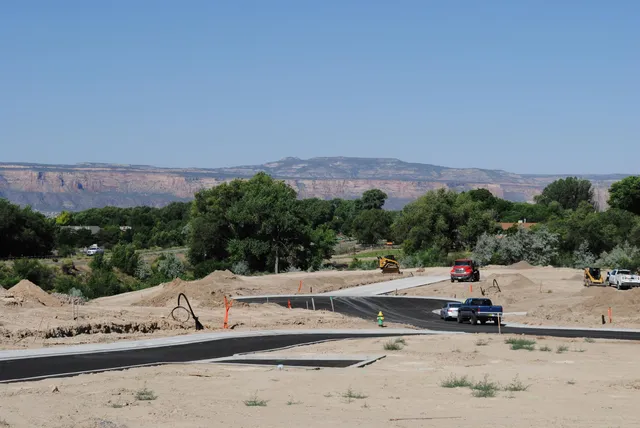 a view of a road with a mountain in the background