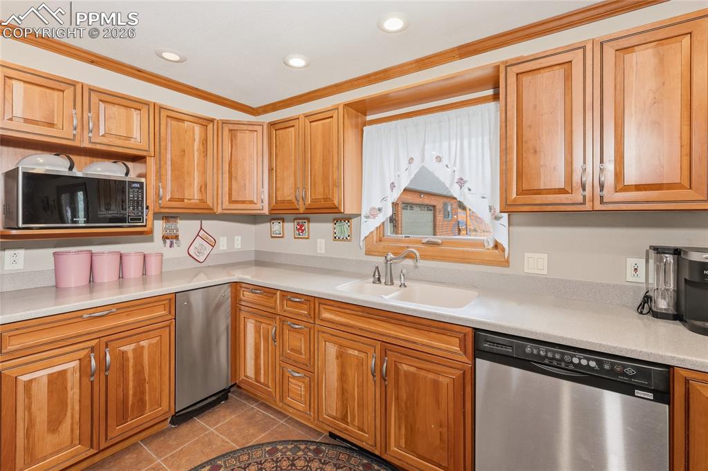 13016 Cielo Grande Road Weston, CO 81091 - Photo 11 of 49 a kitchen with stainless steel appliances granite countertop a sink a stove cabinets and a window