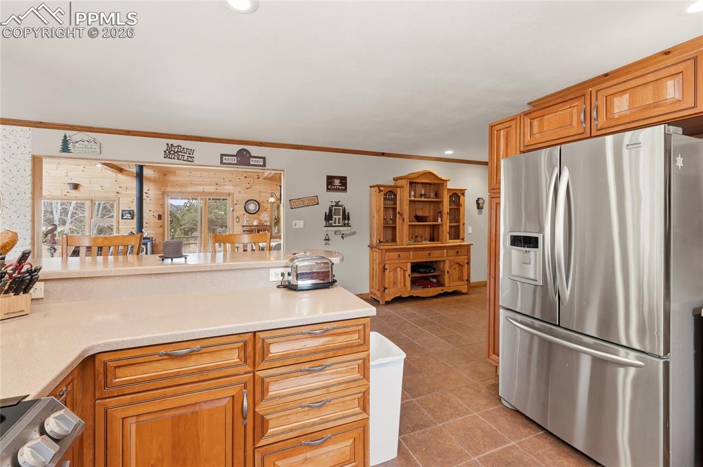 13016 Cielo Grande Road Weston, CO 81091 - Photo 12 of 49 a kitchen with stainless steel appliances granite countertop a refrigerator and a sink