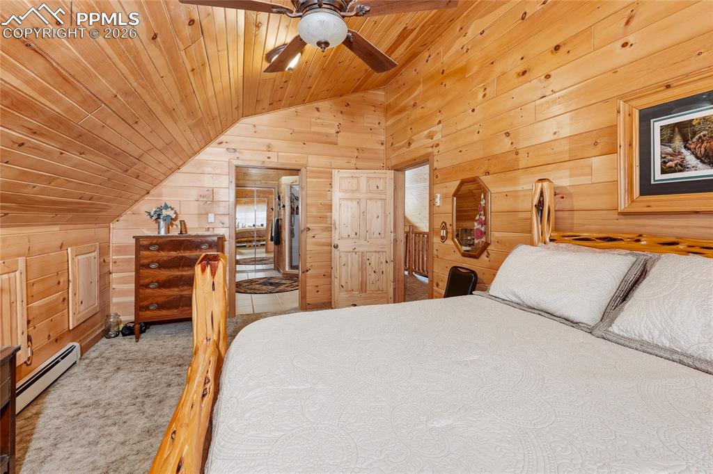 13016 Cielo Grande Road Weston, CO 81091 - Photo 19 of 49 a bedroom with a bed and wooden floor