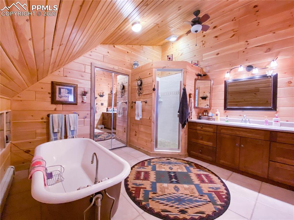 13016 Cielo Grande Road Weston, CO 81091 - Photo 22 of 49 a spacious bathroom with a sink and a mirror