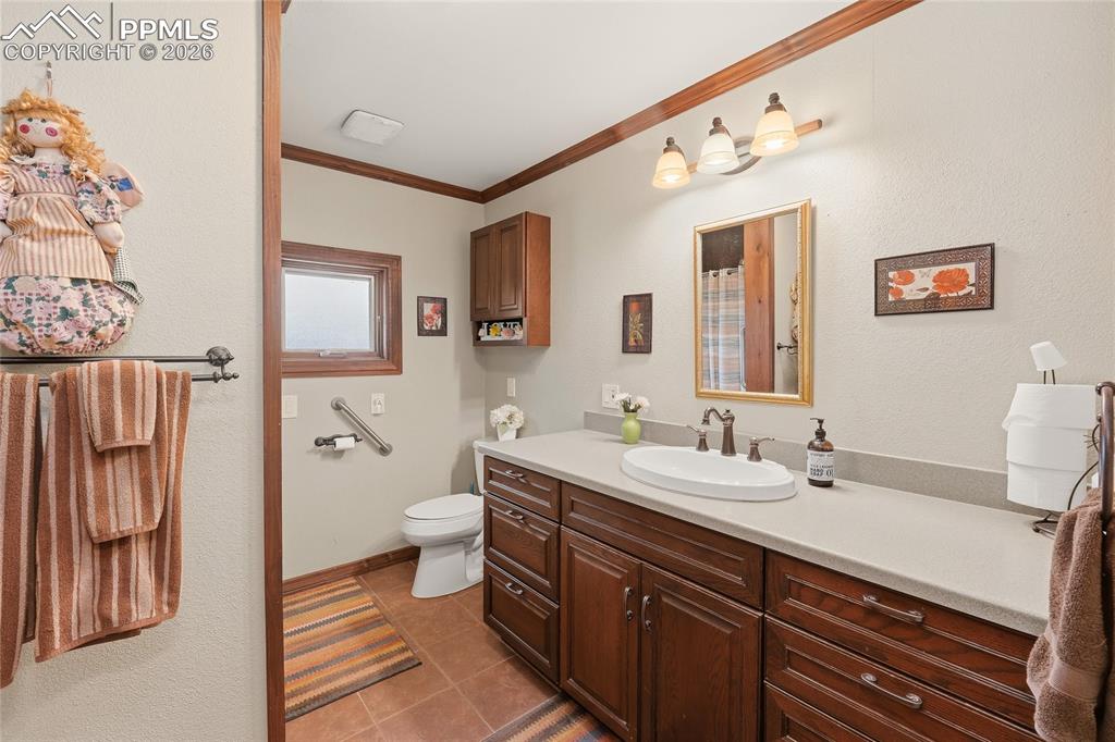 13016 Cielo Grande Road Weston, CO 81091 - Photo 24 of 49 a spacious bathroom with a double vanity sink mirror and toilet