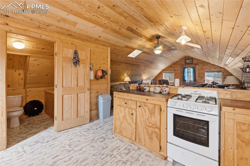13016 Cielo Grande Road Weston, CO 81091 - Photo 38 of 49 a kitchen with stainless steel appliances granite countertop a stove and a refrigerator