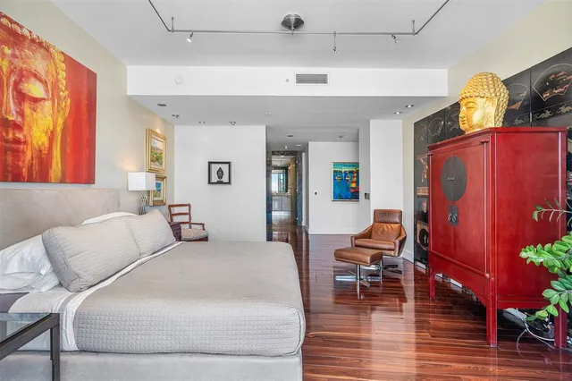 a living room with lots of furniture and a large window