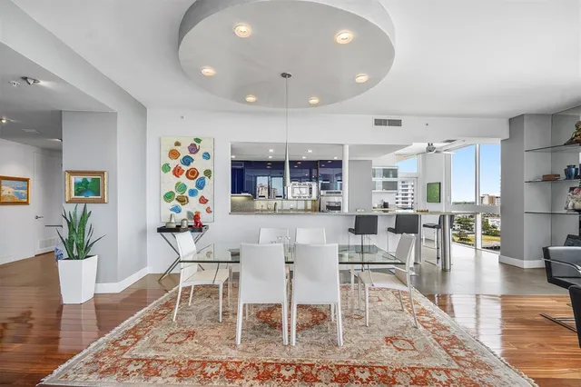a kitchen with stainless steel appliances granite countertop a refrigerator and a stove