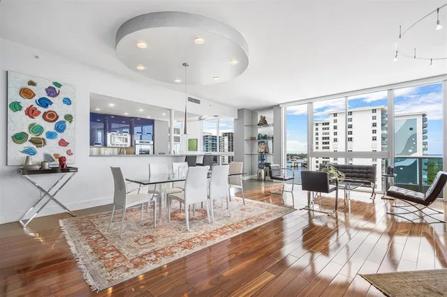 a large kitchen with a large counter top cabinets and stainless steel appliances