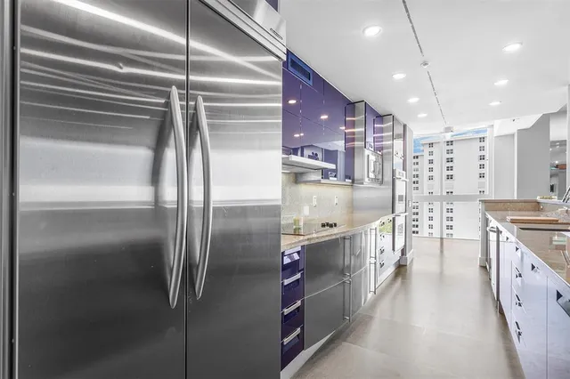 a view of a lake with tall buildings