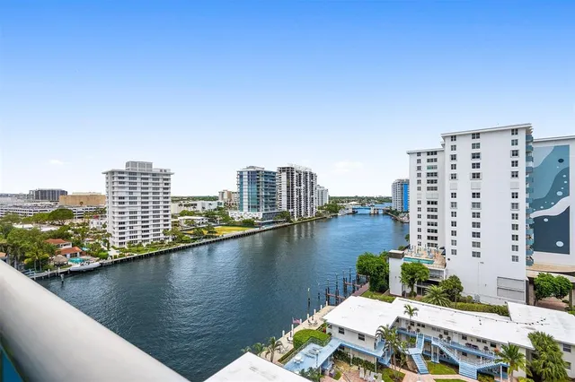 an aerial view of a house with a lake view