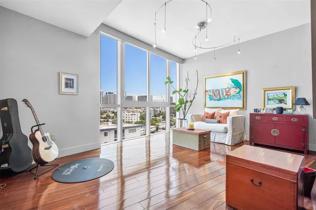 a spacious bedroom with a bed a table and chair