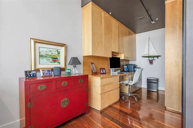 a bedroom with a bed and potted plant