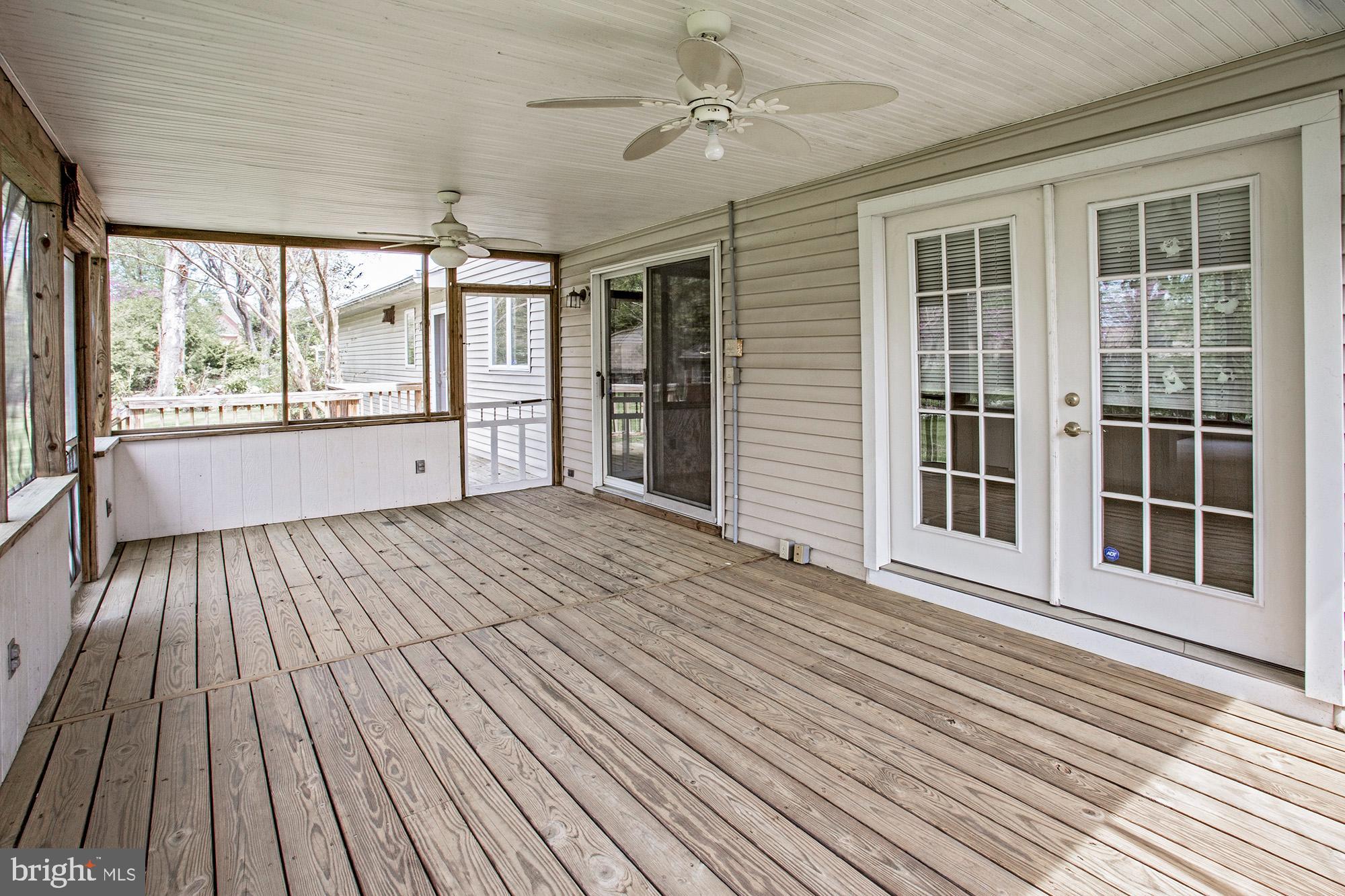 1139 Webster Drive Wilmington, DE 19803 - Photo 11 of 37 a view of a room with wooden floor and ceiling fan