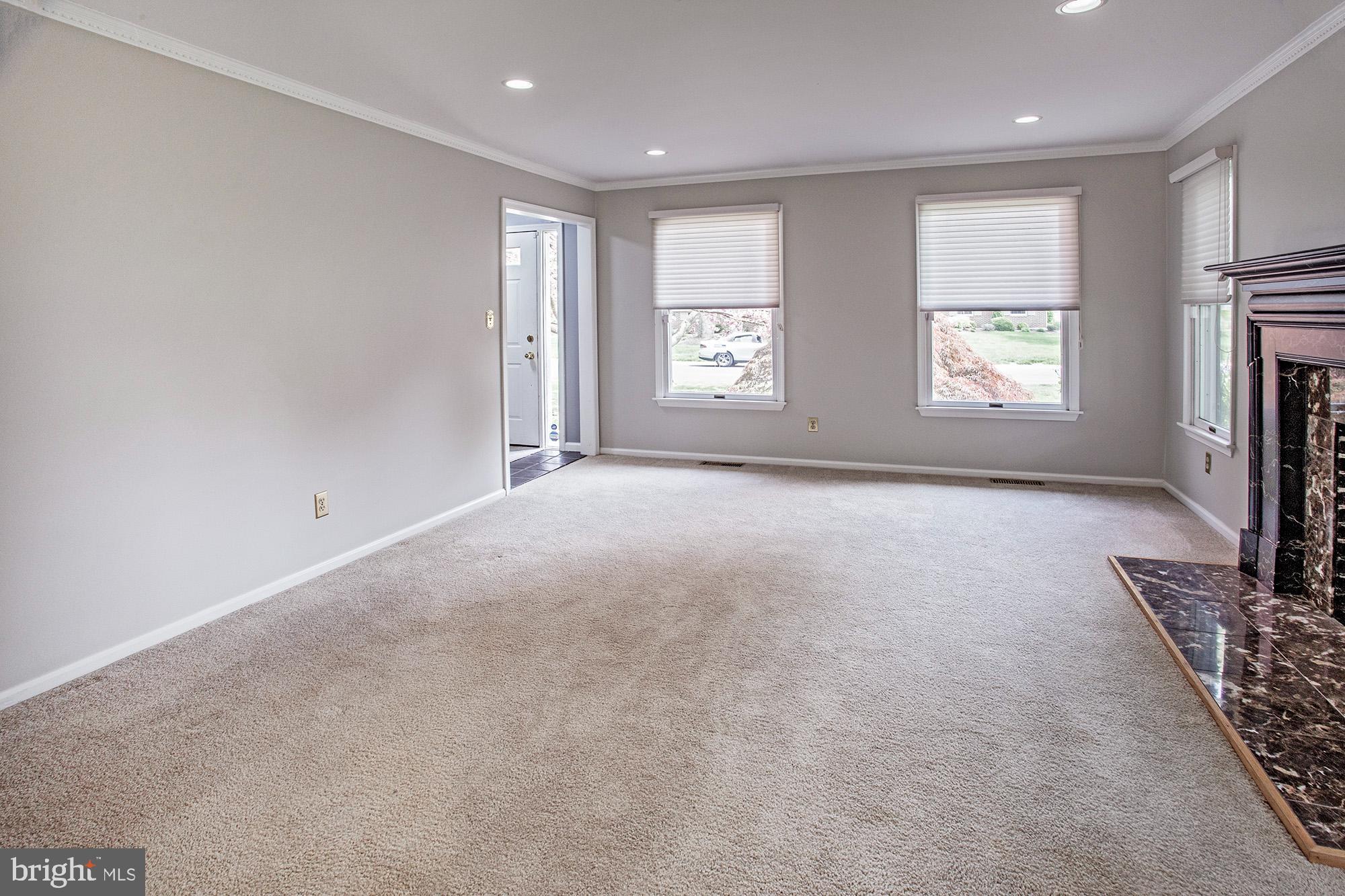 1139 Webster Drive Wilmington, DE 19803 - Photo 22 of 37 a view of an empty room with a window and fireplace