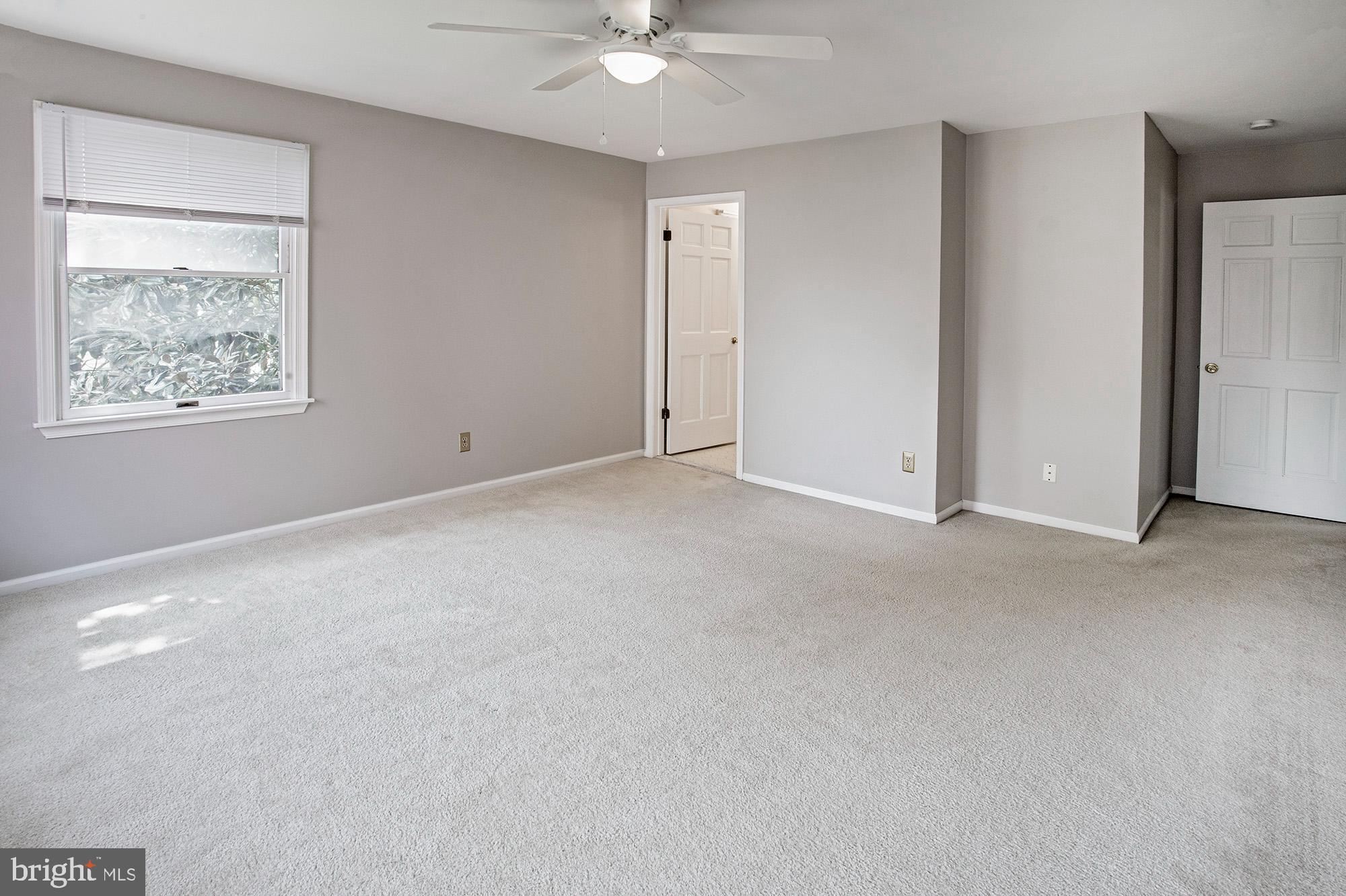 1139 Webster Drive Wilmington, DE 19803 - Photo 26 of 37 an empty room with a ceiling fan and window
