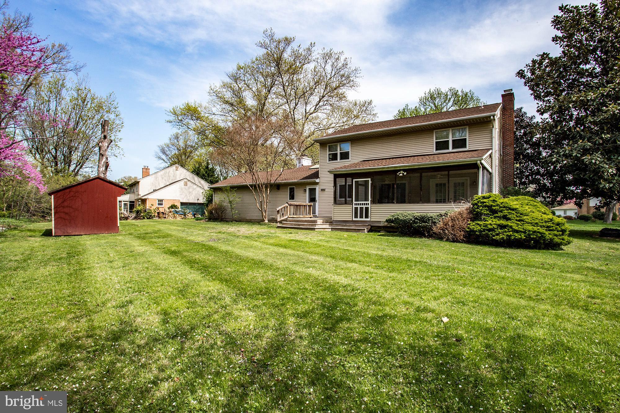1139 Webster Drive Wilmington, DE 19803 - Photo 3 of 37 a front view of house with yard and trees in the background