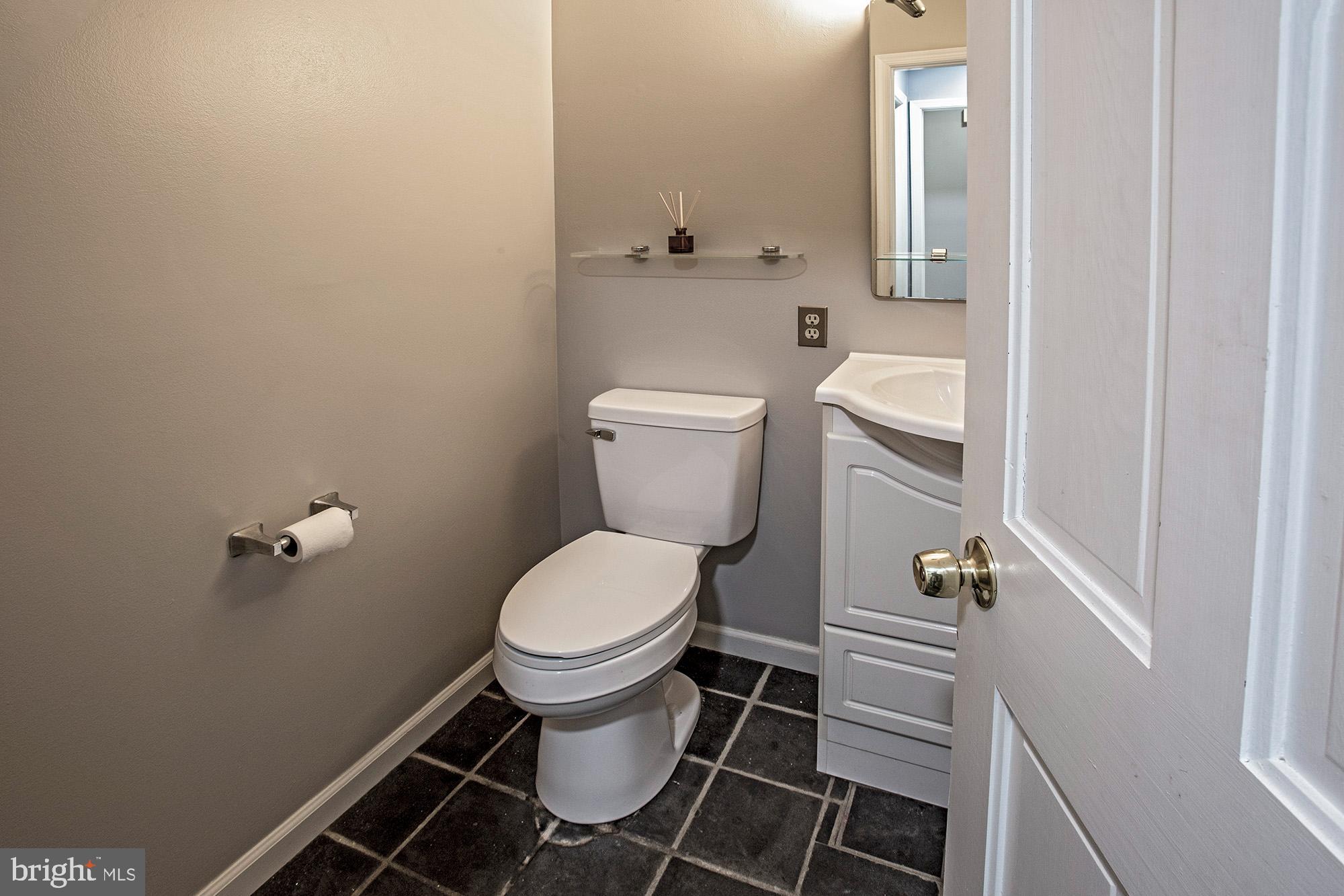 1139 Webster Drive Wilmington, DE 19803 - Photo 35 of 37 a white toilet sitting next to a bathroom sink