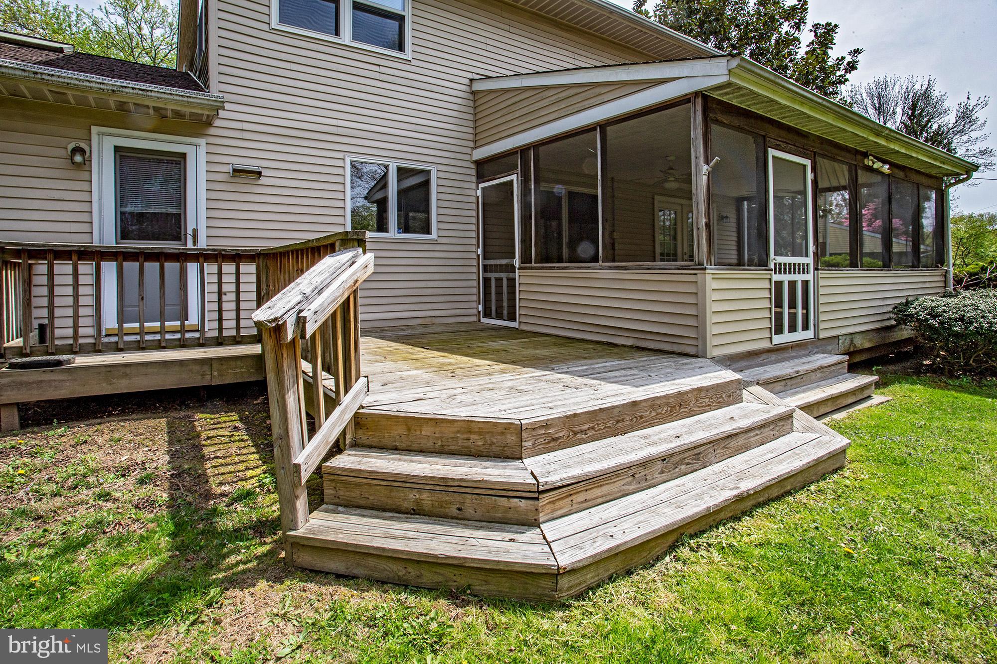 1139 Webster Drive Wilmington, DE 19803 - Photo 4 of 37 a view of a wooden deck and a yard