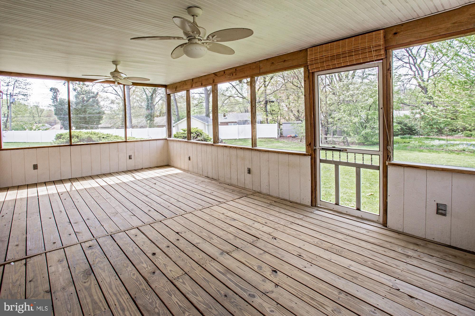 1139 Webster Drive Wilmington, DE 19803 - Photo 10 of 37 an empty room with wooden floor and windows
