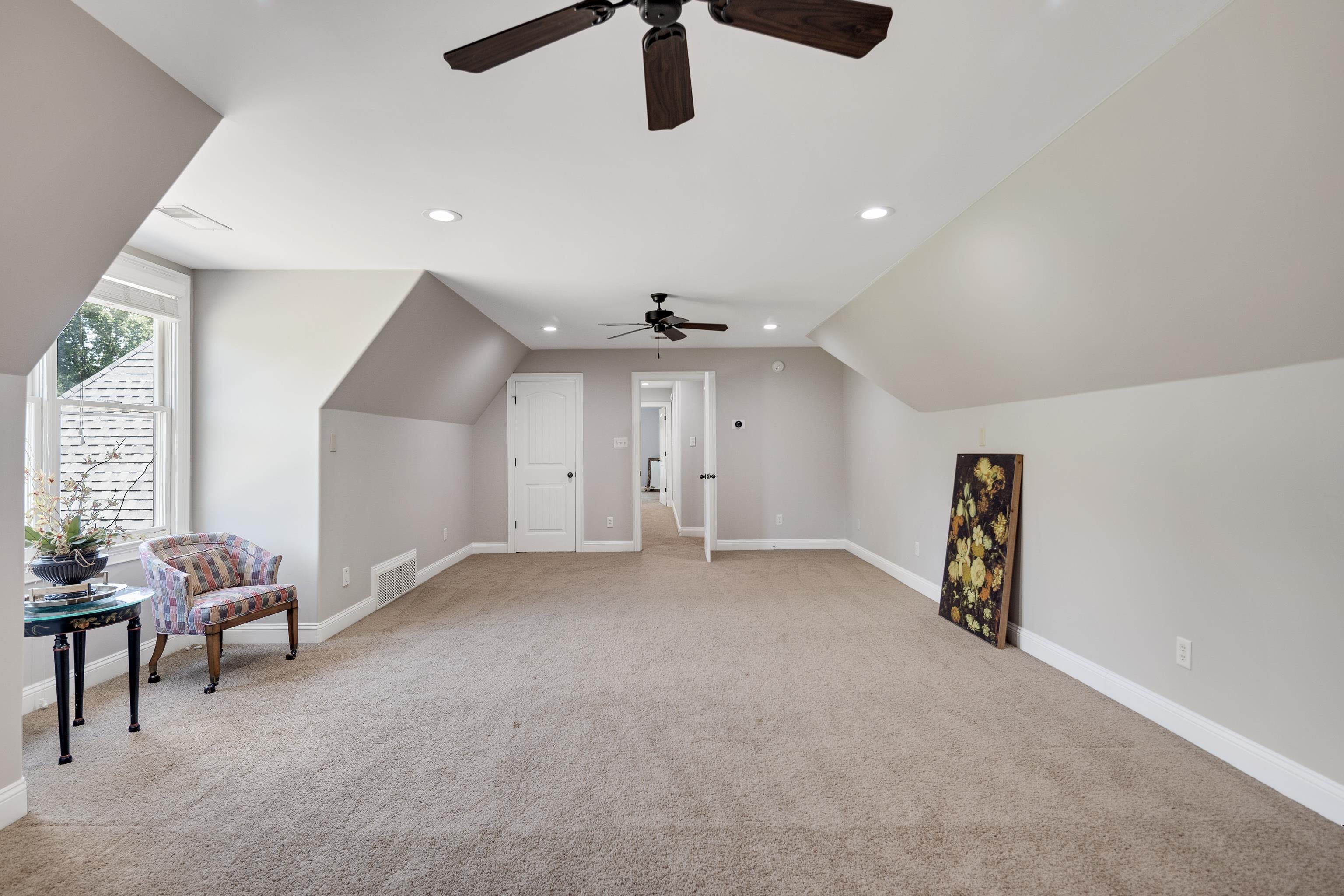 9028 Osborntown Road Arlington, TN 38002 - Photo 31 of 40 an empty room with windows and ceiling fan