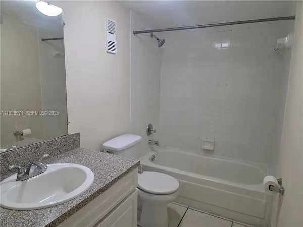 a bathroom with a sink toilet and a bathtub