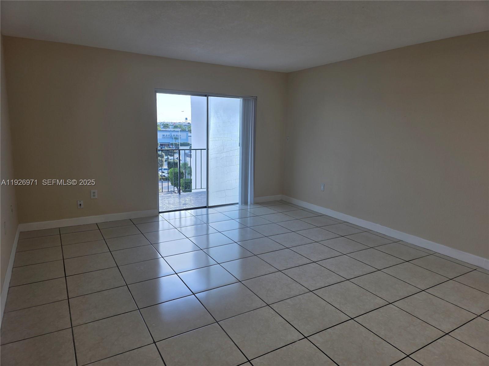 4400 West 16th Avenue, Unit 630 Hialeah, FL 33012 - Photo 2 of 34 a view of an empty room and window