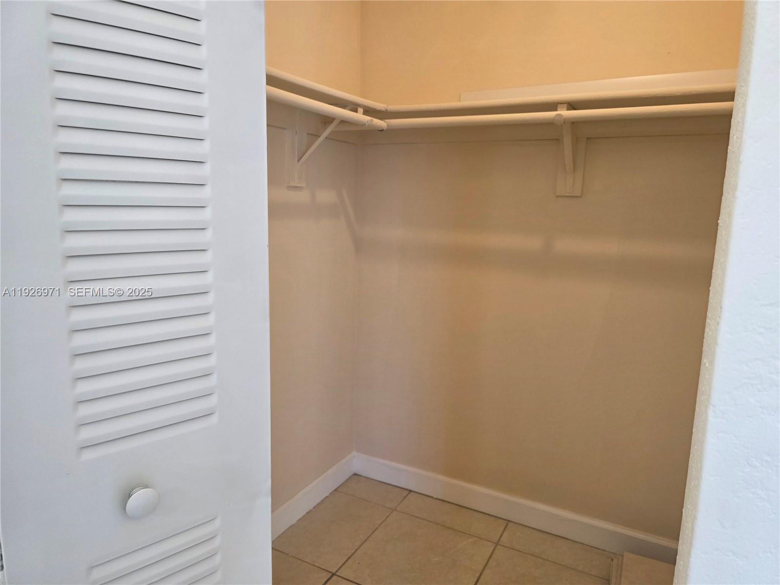 4400 West 16th Avenue, Unit 630 Hialeah, FL 33012 - Photo 26 of 34 a view of walk in closet