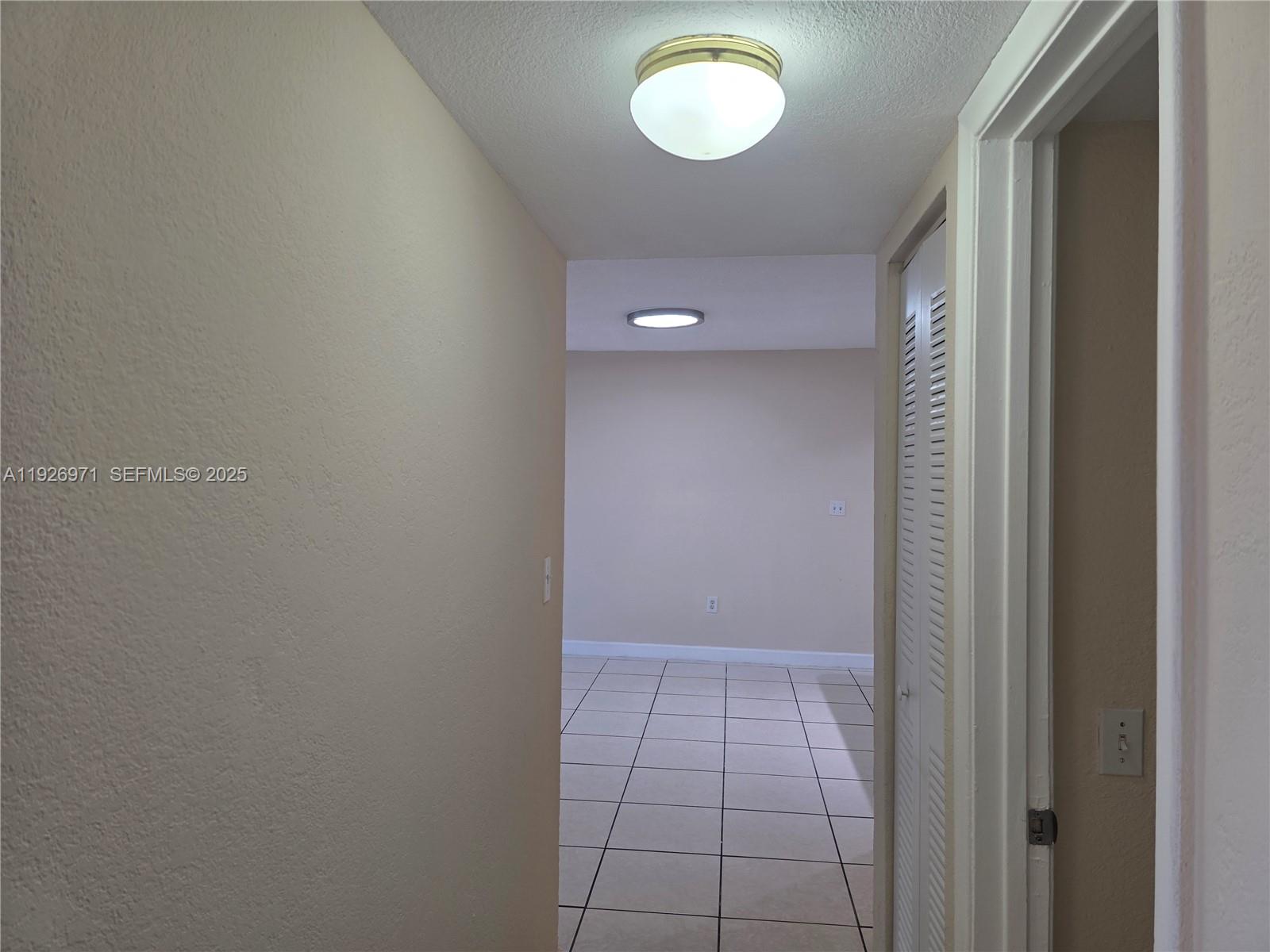 4400 West 16th Avenue, Unit 630 Hialeah, FL 33012 - Photo 27 of 34 a view of an empty room and window