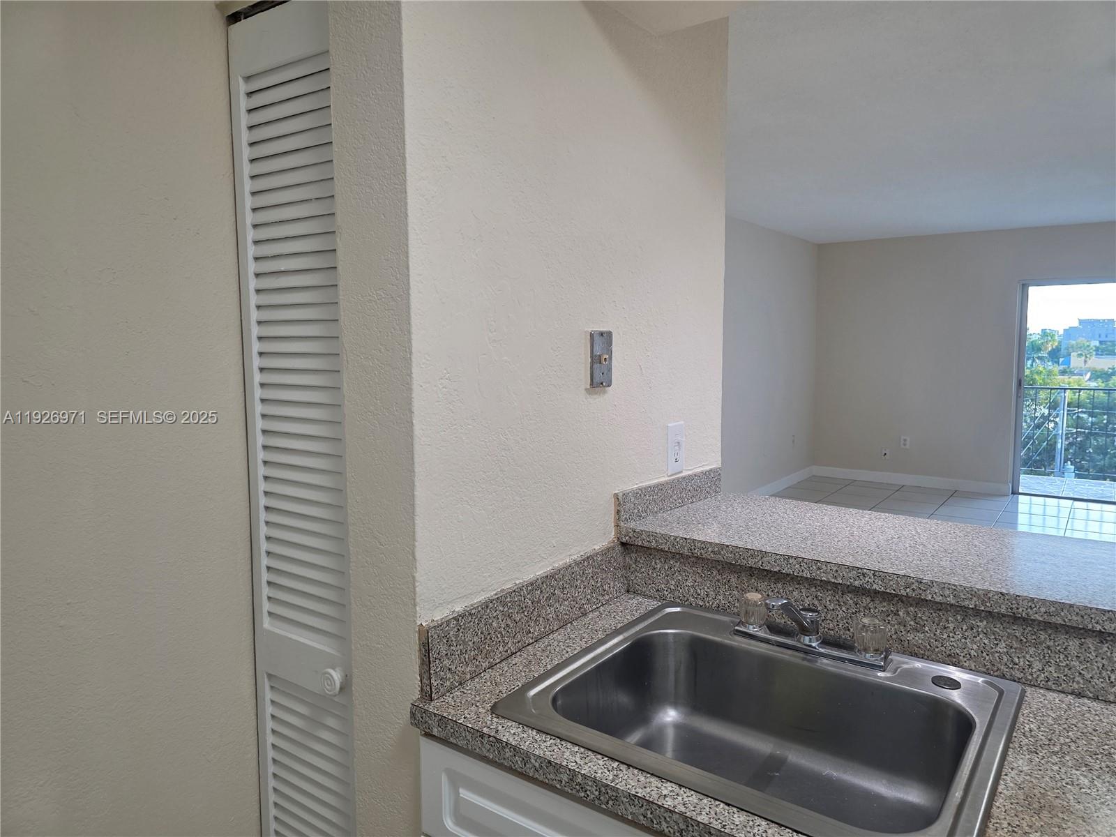 4400 West 16th Avenue, Unit 630 Hialeah, FL 33012 - Photo 5 of 34 a close view of a sink and dishwasher in a kitchen