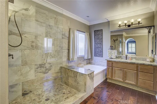 a spacious bathroom with sink shower and mirror