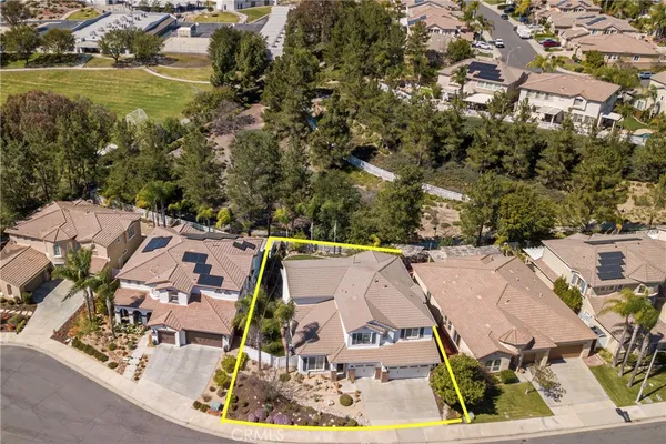 an aerial view of residential house with outdoor space