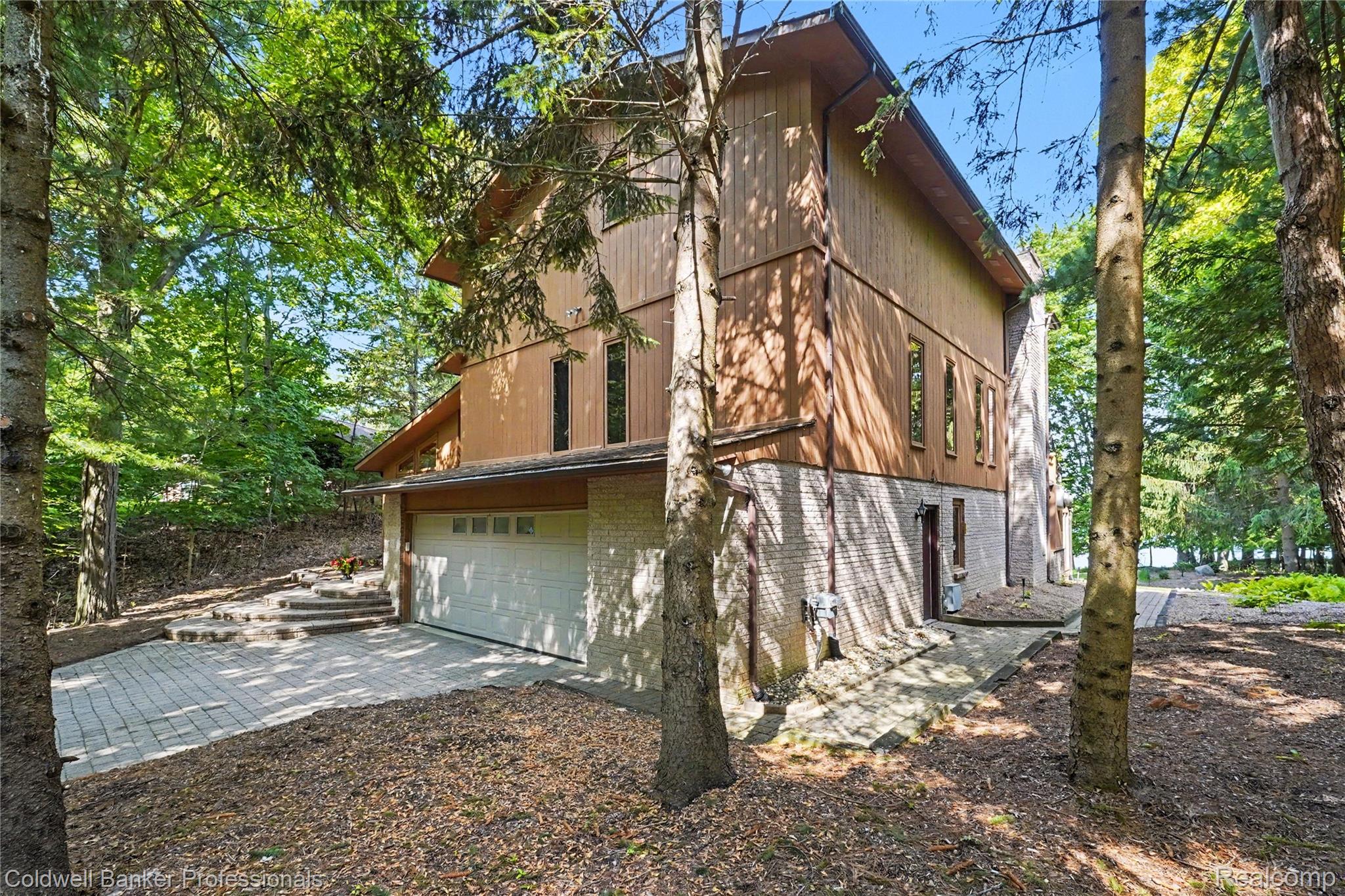 3583 Mitchell Road Metamora, MI 48455 - Photo 6 of 58 Multi-level exterior with a two-car garage