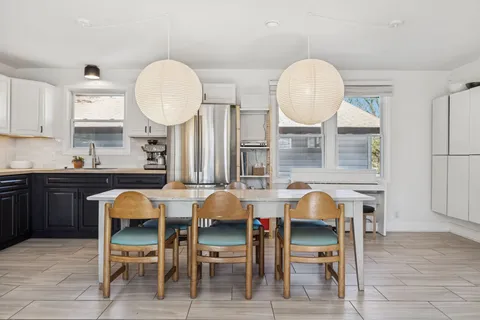 a view of dining table and chairs