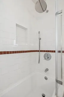 a bathroom with a shower and a bathtub