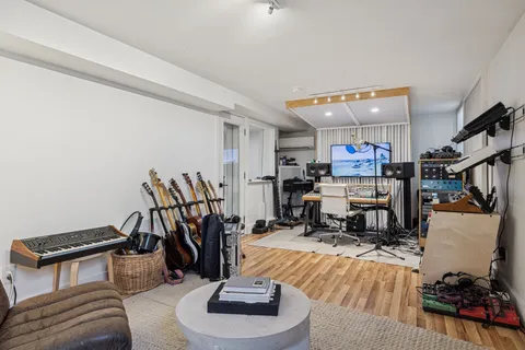 a living room with lots of furniture and a wooden floor