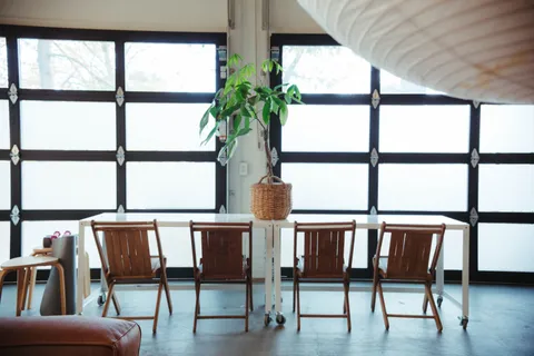 a view of a chairs and table in a room
