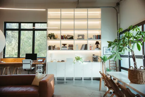 a dining room with furniture window and wooden floor