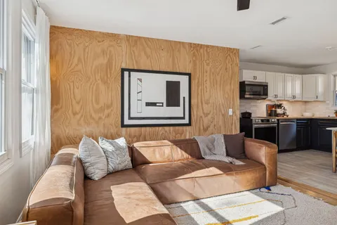 a living room with furniture and a couch