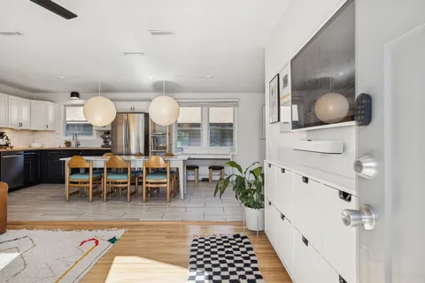 a kitchen with granite countertop a sink and cabinets