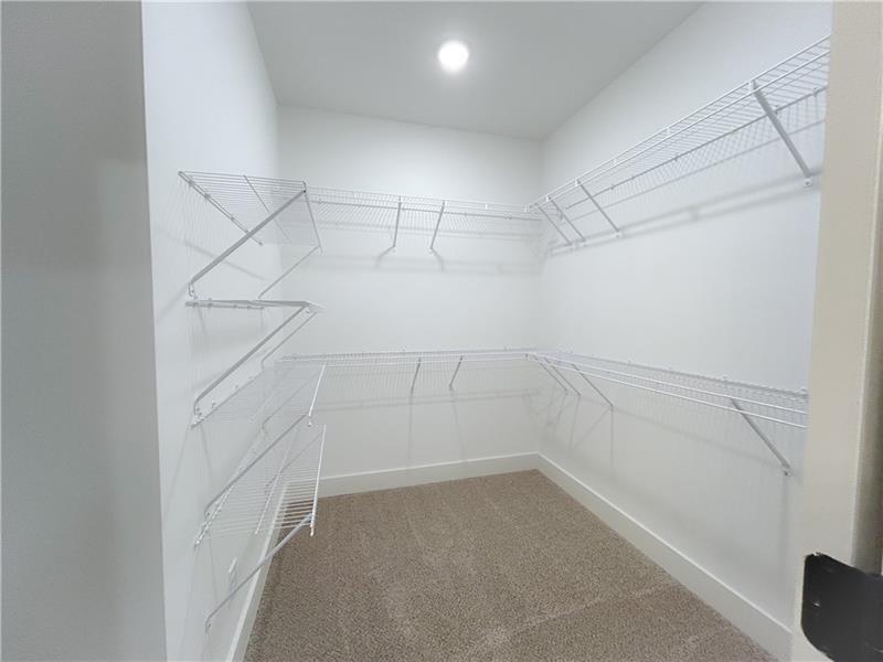 27 Bridgestone Way Cartersville, GA 30120 - Photo 30 of 31 a view of a room with racks on the wall