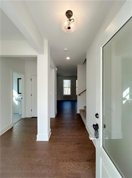 27 Bridgestone Way Cartersville, GA 30120 - Photo 4 of 31 a view of a hallway with wooden floor and a bathroom