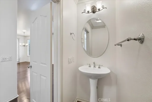 a bathroom with a sink a mirror and shower