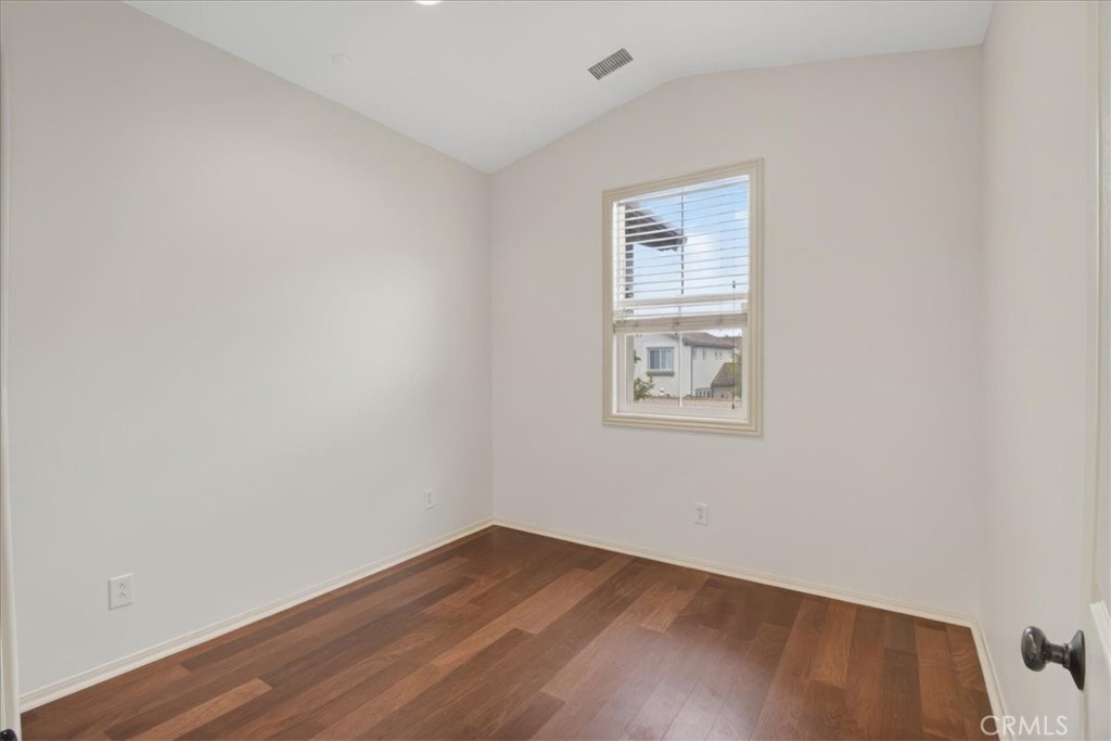 19266 Scripts Court Huntington Beach, CA 92648 - Photo 23 of 47 a view of an empty room with wooden floor