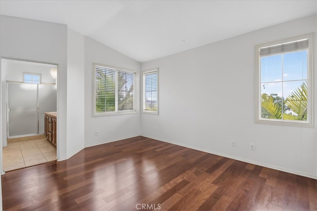 19266 Scripts Court Huntington Beach, CA 92648 - Photo 26 of 47 a view of an empty room with window and wooden floor