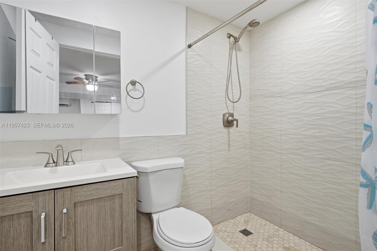 941 East 16th Place Hialeah, FL 33010 - Photo 18 of 32 a bathroom with a sink a toilet and shower