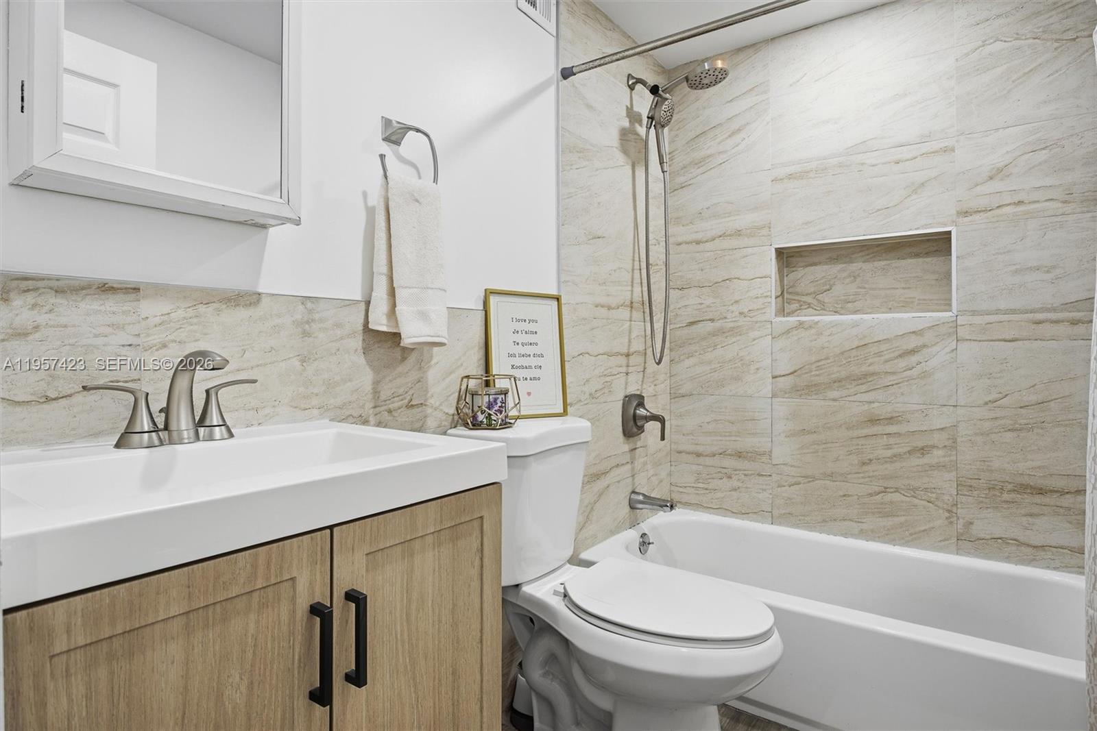 941 East 16th Place Hialeah, FL 33010 - Photo 22 of 32 a bathroom with a sink a toilet and shower