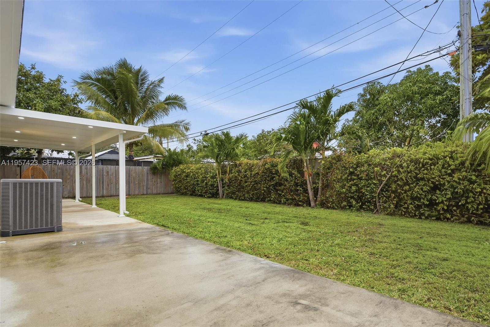 941 East 16th Place Hialeah, FL 33010 - Photo 28 of 32 a garden with trees in front of it
