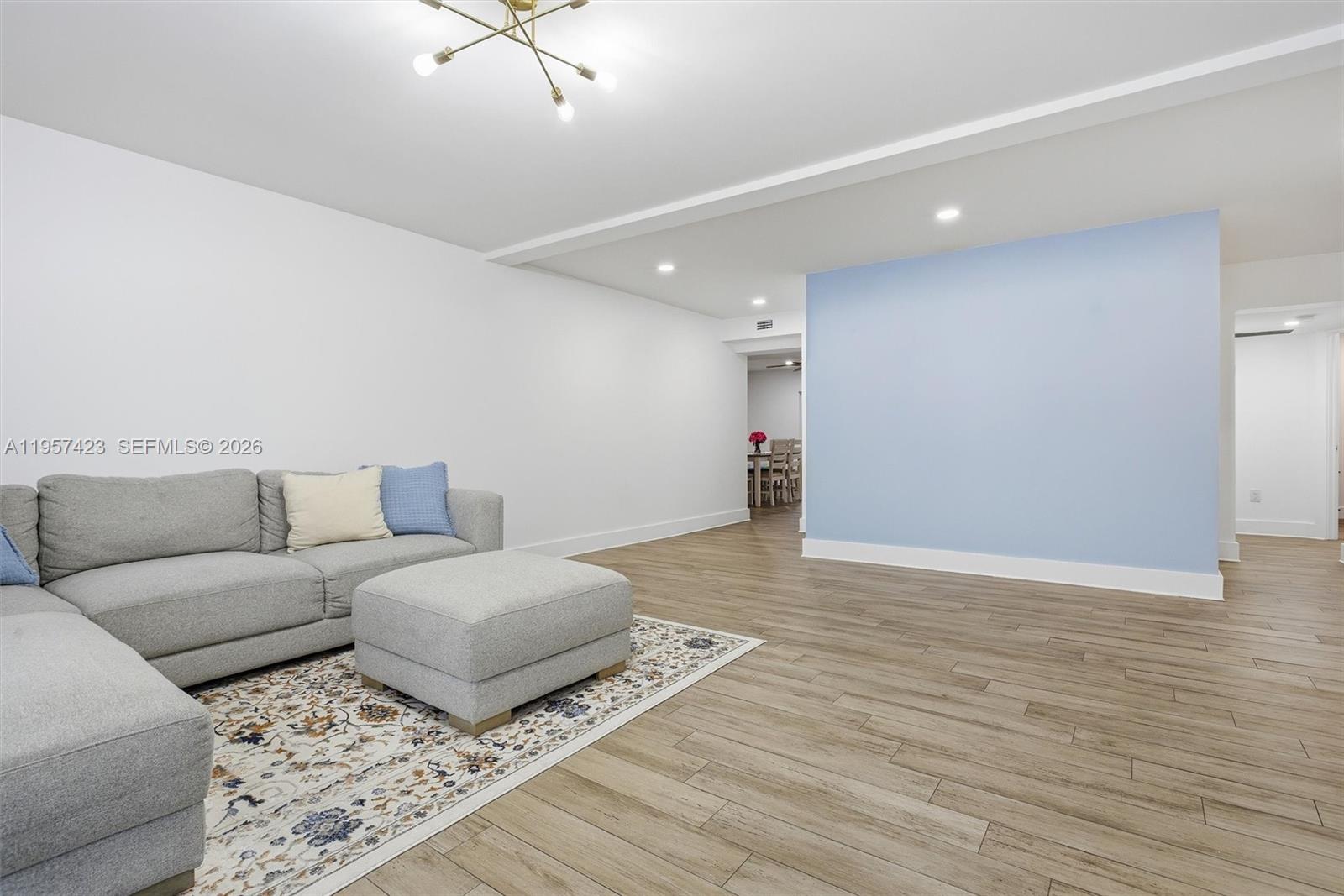 941 East 16th Place Hialeah, FL 33010 - Photo 4 of 32 a living room with furniture and a ceiling fan