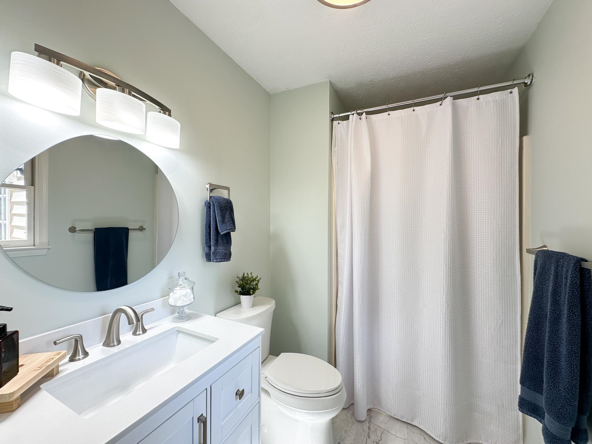 564 Union Church Road Churchville, VA 24421 - Photo 23 of 35 a bathroom with a sink mirror vanity and toilet
