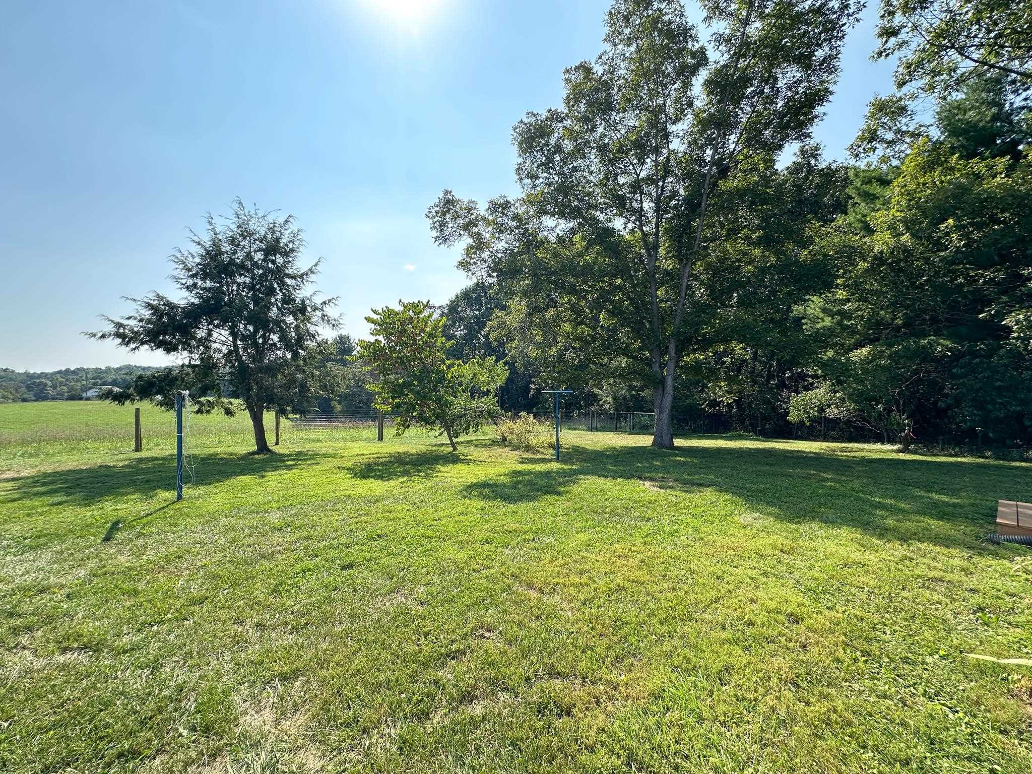 564 Union Church Road Churchville, VA 24421 - Photo 33 of 35 a swimming pool with lots of green space and trees in the background