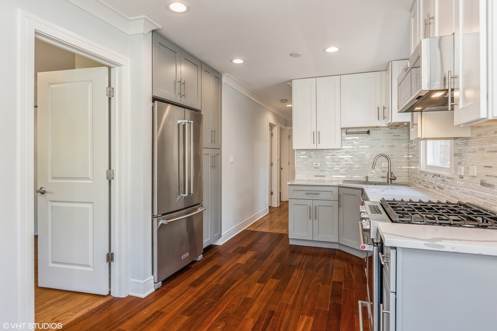 4150 Main Street Skokie, IL 60076 - Photo 11 of 28 a kitchen with stainless steel appliances granite countertop a refrigerator and a stove top oven