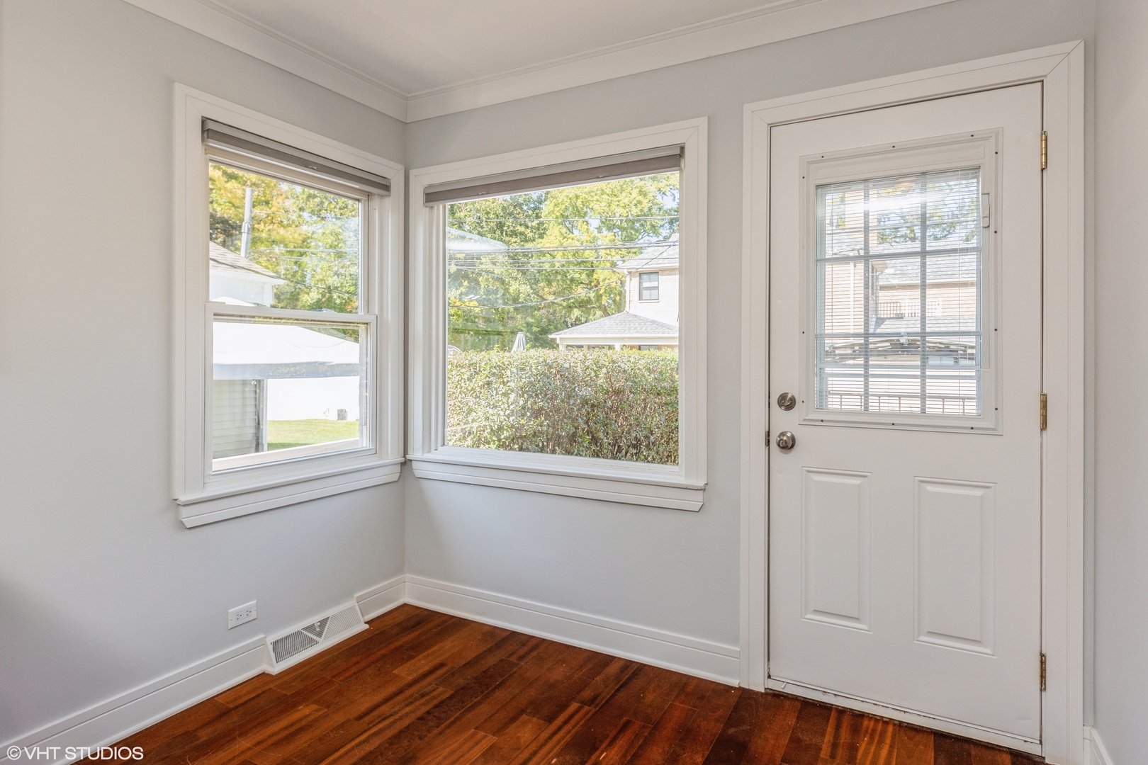 4150 Main Street Skokie, IL 60076 - Photo 12 of 28 an empty room with wooden floor and windows